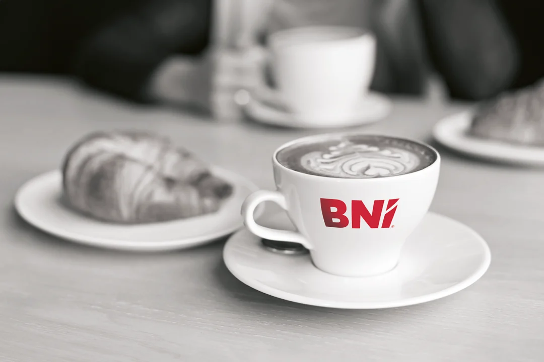 Cup of coffee with BNI logo on